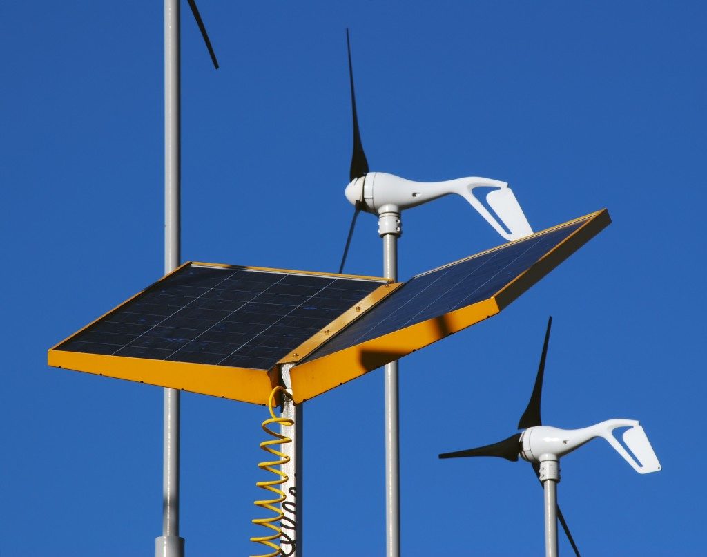 Close-up of wind and solar power generators