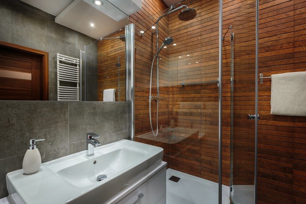 A modern bathroom with brown walls