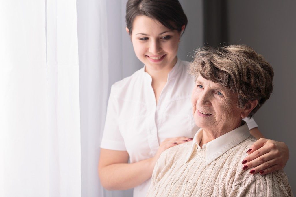woman caring for a senior citizen