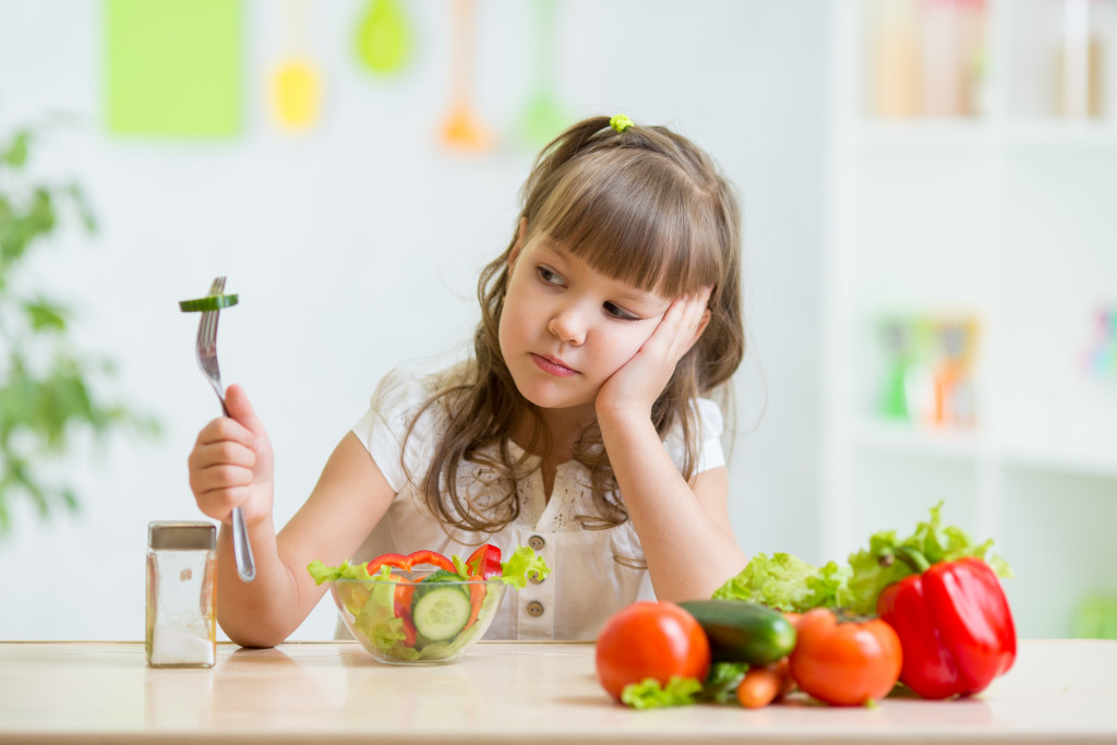vegetables in front of a child