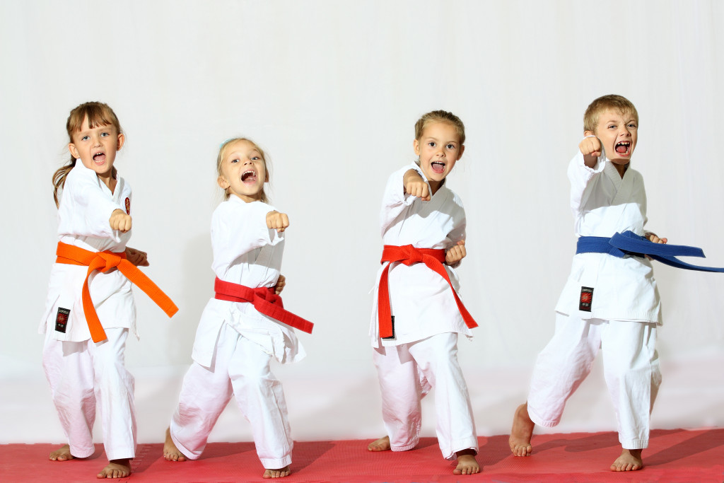 children learning martial arts