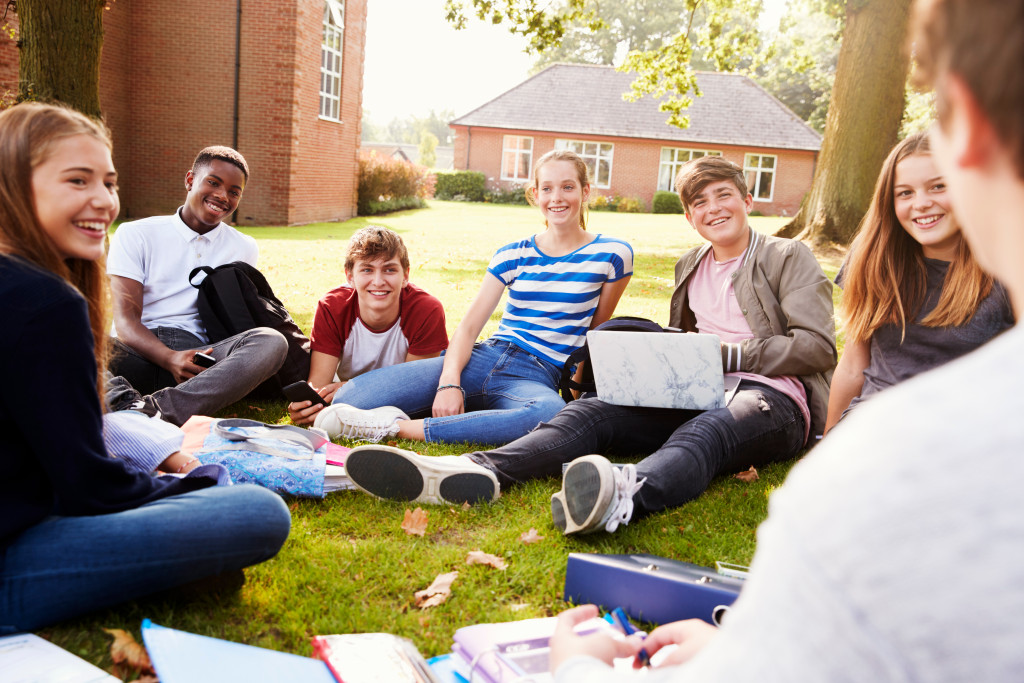 teenagers meeting on a school field