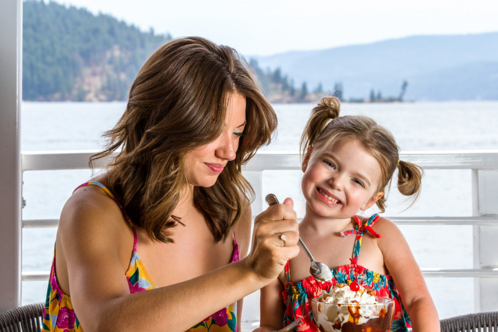 mother and daughter eating a sundae 