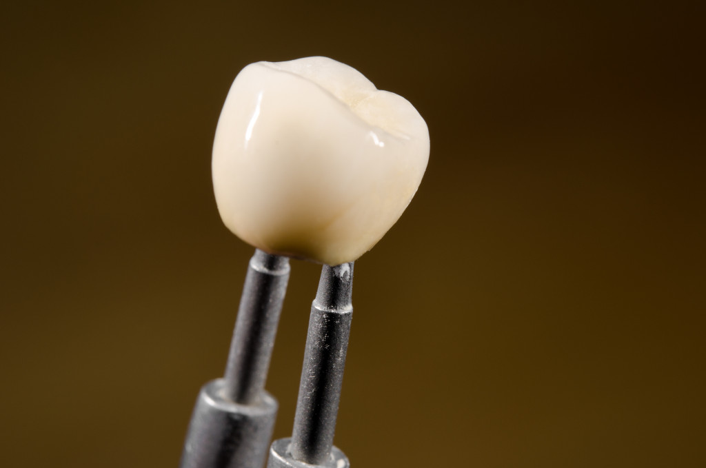Dental replacement being held