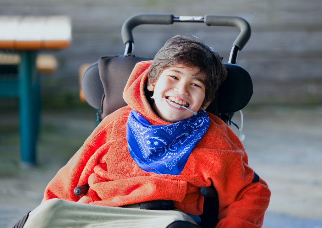 little boy in wheelchair smiling