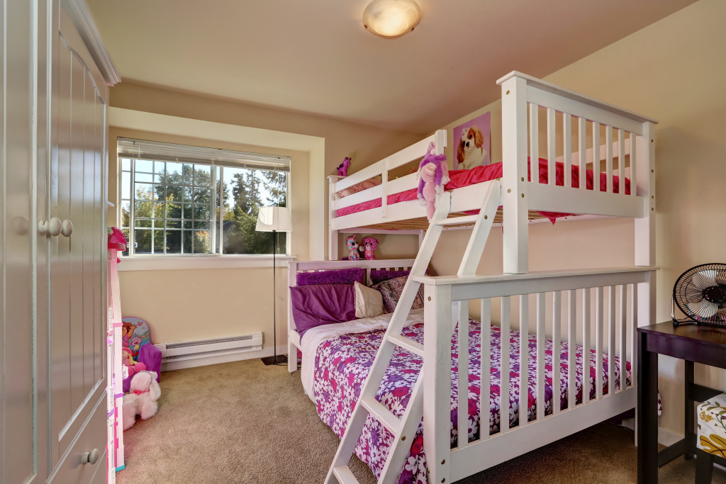 A bunk bed in a girl's bedroom