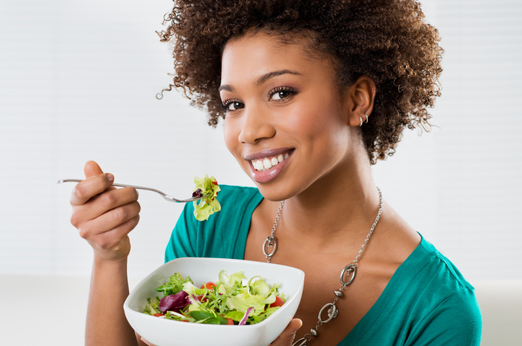 woman eating veggies