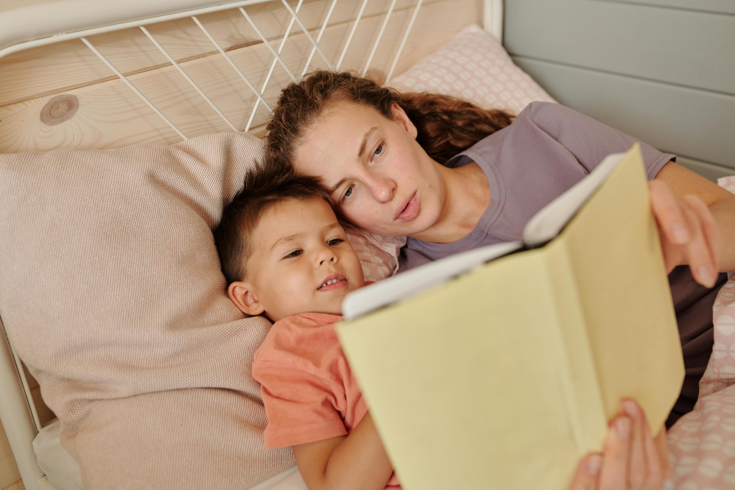 mother reading a bedtime story to her son